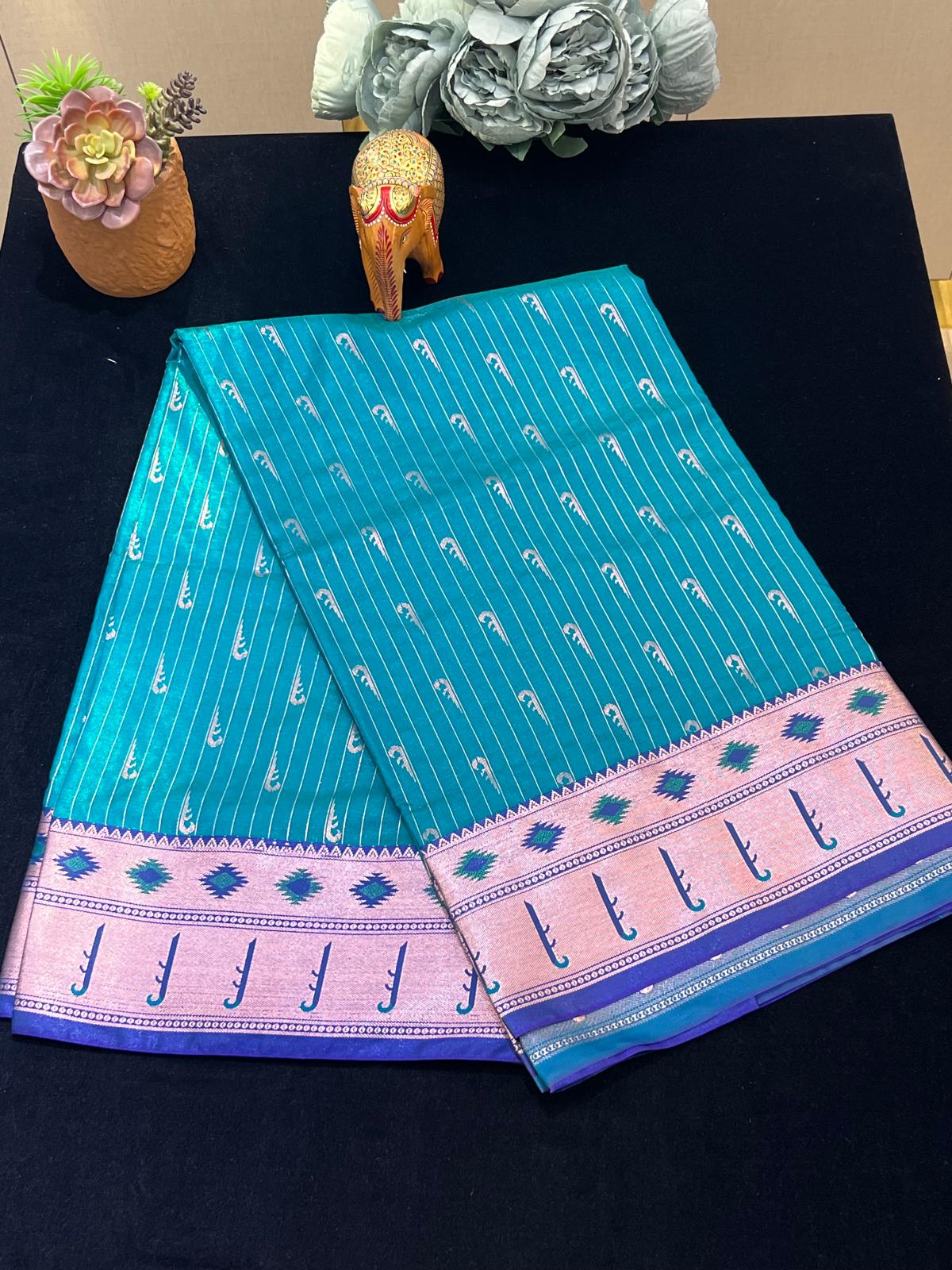 Satin pattu saree with Muniya motiffs